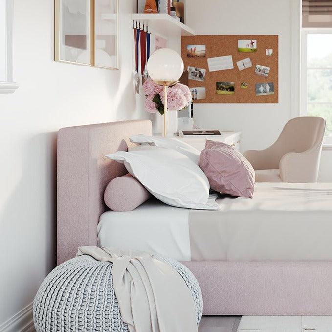 Pink upholstered headboard with a pink bolster pillow | SoftFrame Designs