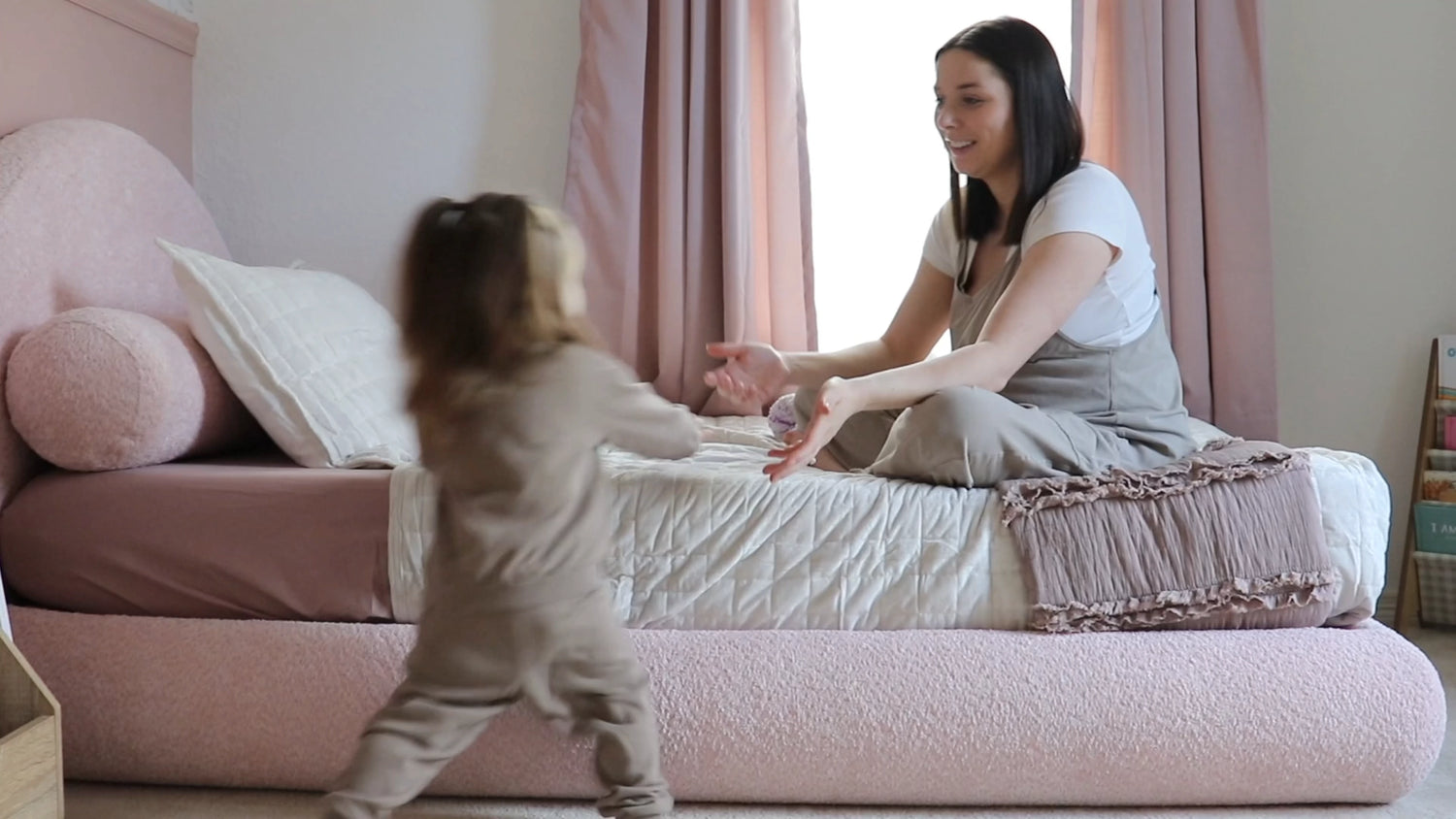 Toddler running towards mom on a Soft Frame bed | Kids Luna Bed Set in Cotton Candy pink | SoftFrame Designs
