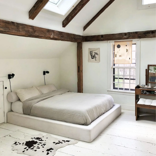 The Ultra bed frame by SoftFrame Designs in decorated room featuring a cow print rug