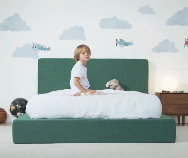 Green bed with boy