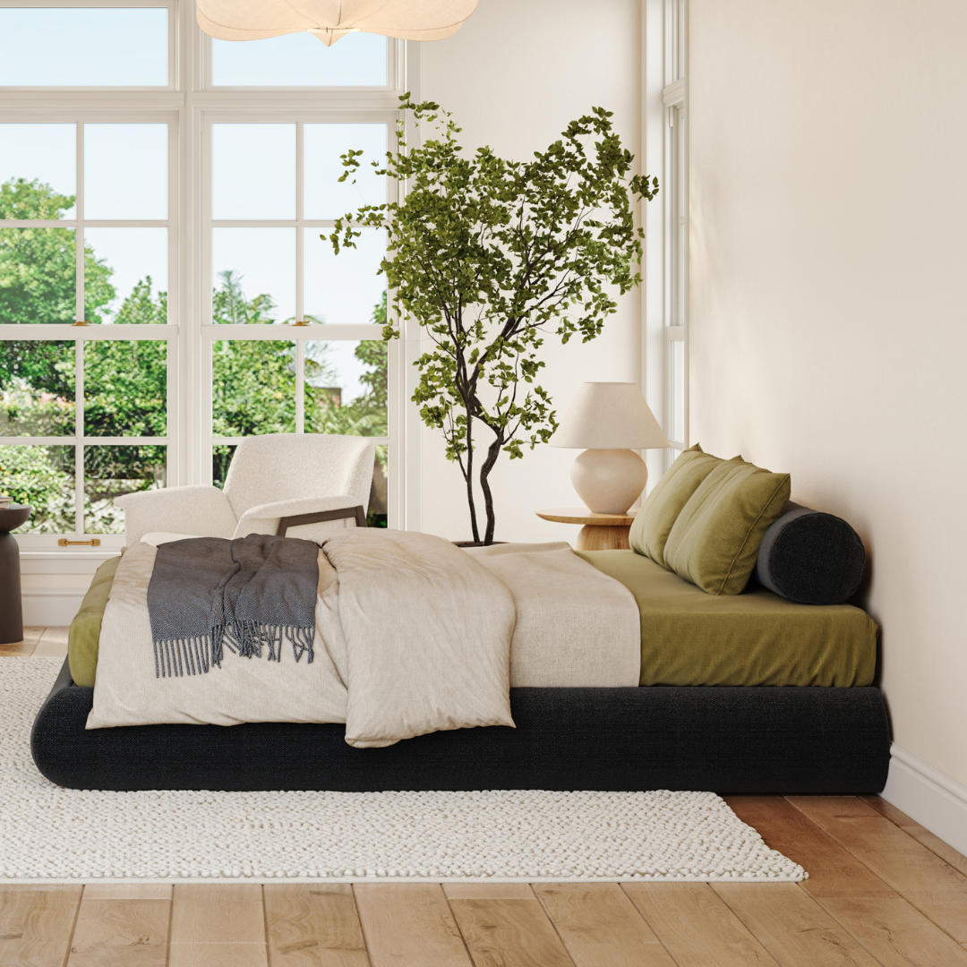 Luna Onyx bed frame| Onyx round bolster| Side view bed frame| All cushioned bed frame| Green sheets