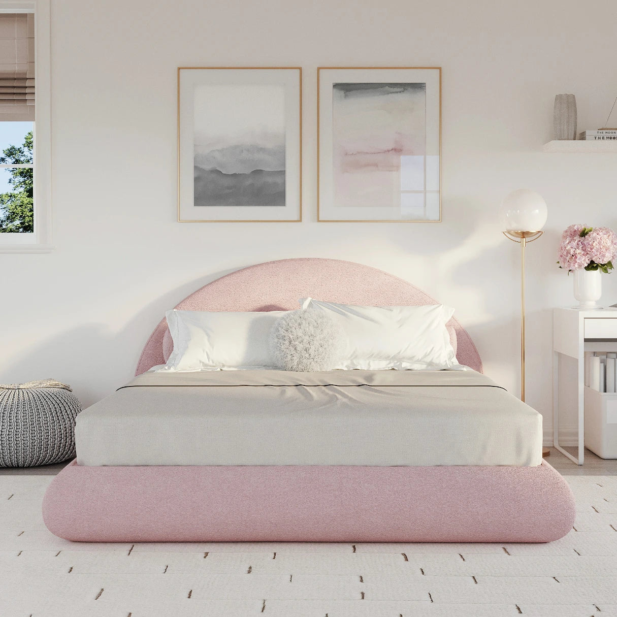 Pink all cushioned bed in a bedroom with white walls and decor