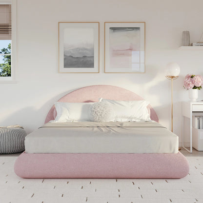 Pink all cushioned bed in a bedroom with white walls and decor