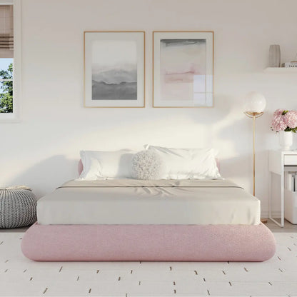Pink all cushioned bed frame in a girls room