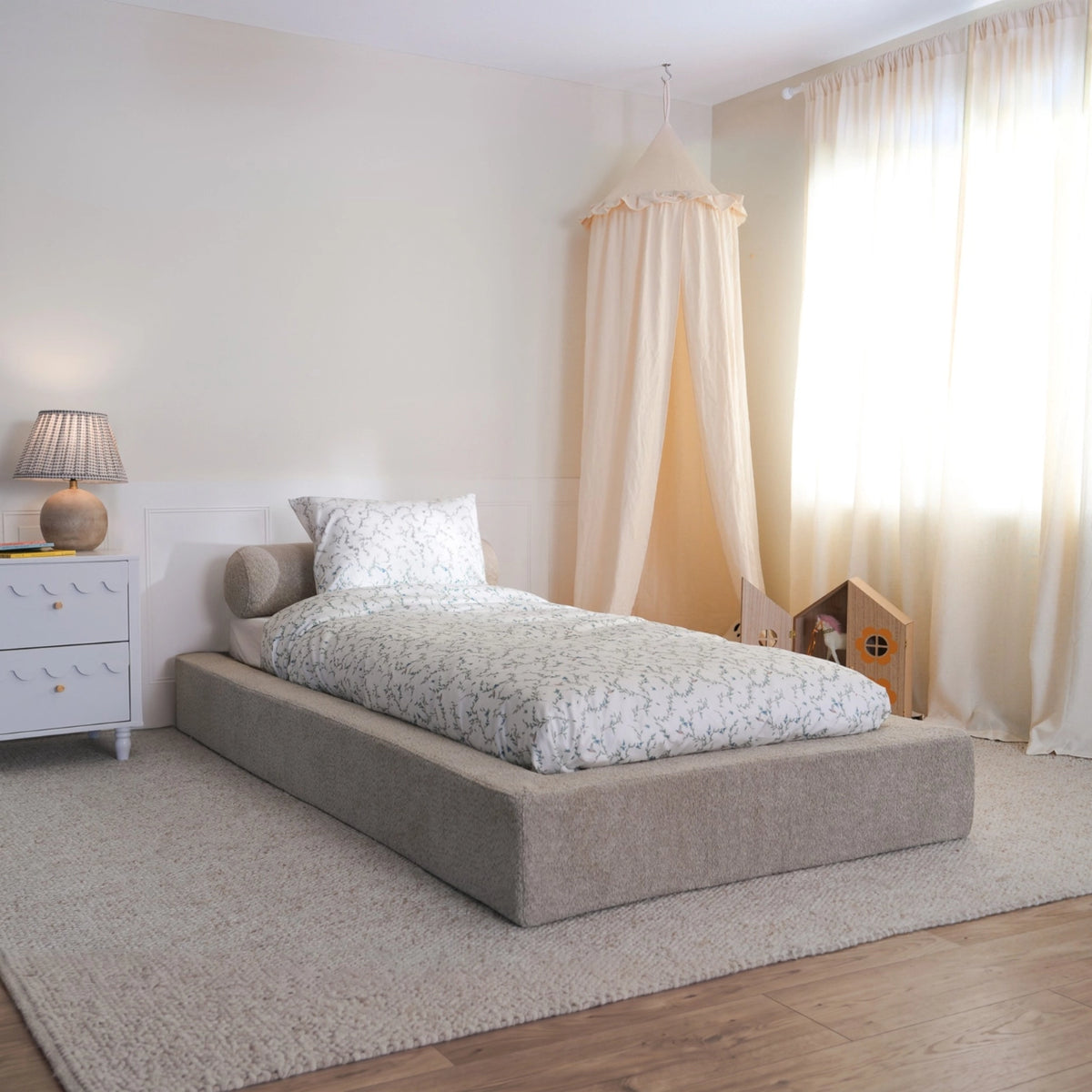 Teddy bed frame in ultra by softframe designs in a 3/4 view angle. The bed has leave design sheets.