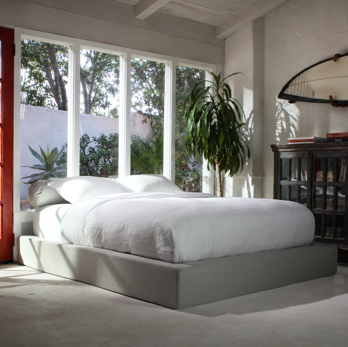 Gray all cushioned bed frame in a beach room