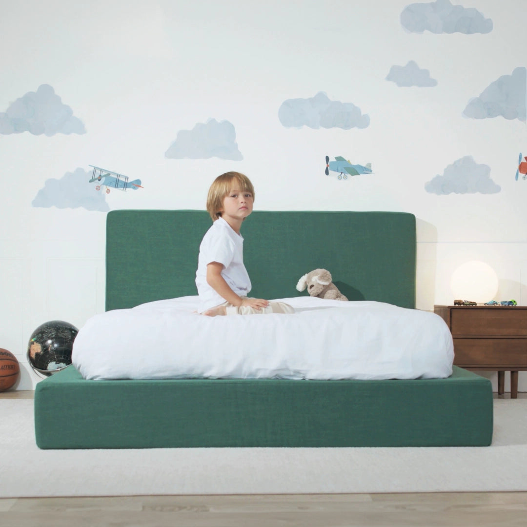 A kids' bedroom featuring a green upholstered bed frame and headboard | Twin, Ultra Bed Set in Forest Green | SoftFrame Designs
