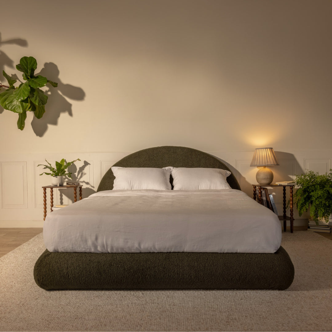 Bedroom with an olive green, boucle bed frame, nightstands, and lamps against a neutral wall | Luna Set in Moss | SoftFrame® Designs