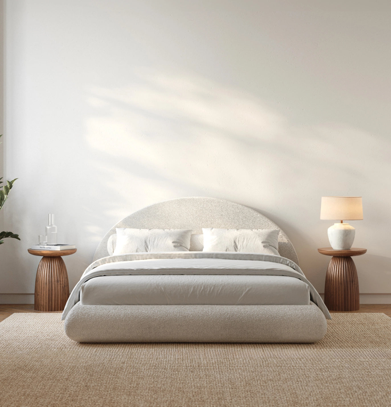 Modern bedroom with a moon-shaped bed in a minimalistic setting