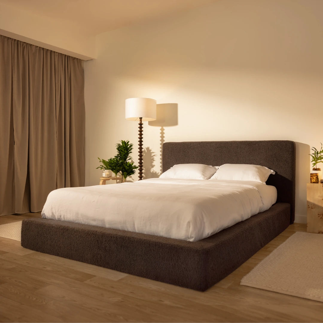 Bedroom with a brown soft upholstered bed frame and headboard, lamps, and decor in a cozy setting | Ultra Bed Set in Chocolate | SoftFrame® Designs