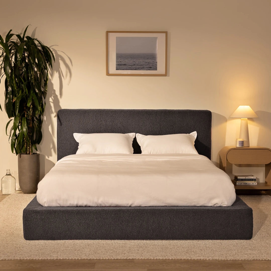 Modern bedroom with a charcoal grey bed frame, nightstand, and decorative elements | Ultra Bed Set in Storm | SoftFrame® Designs