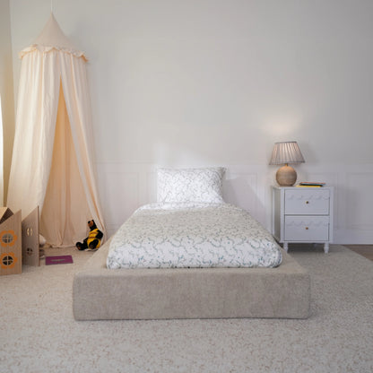 Teddy bed frame in ultra by softframe designs in a front view angle. The bed has leave design sheets.