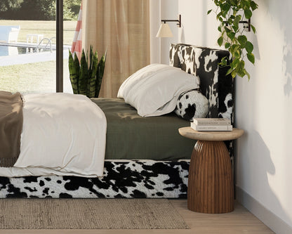 Vegan cowhide all cushioned headboard in a minimalist bedroom with a pool view