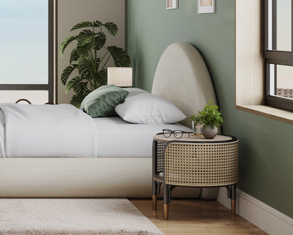Modern bedroom with a bed, nightstand, and decorative items.