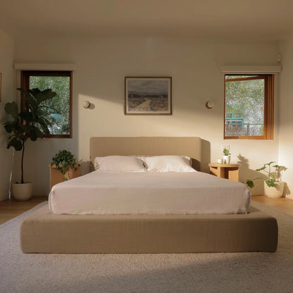 Modern warm, and earthy bedroom with a soft tan bed frame , side tables, and wall art | Ultra Set, Queen, Sahara Tan | SoftFrame Designs