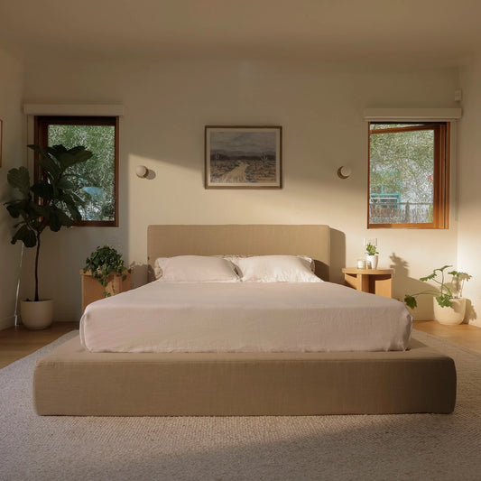 Modern warm, and earthy bedroom with a soft tan bed frame , side tables, and wall art | Ultra Set, Queen, Sahara Tan | SoftFrame Designs