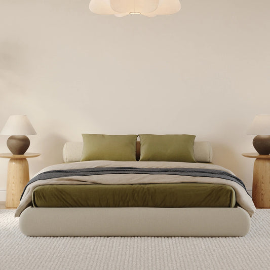 Luna dune bed frame| All cushioned bed frame| SoftFrame Designs| Beige bed| Bolster pillow| Front view angle