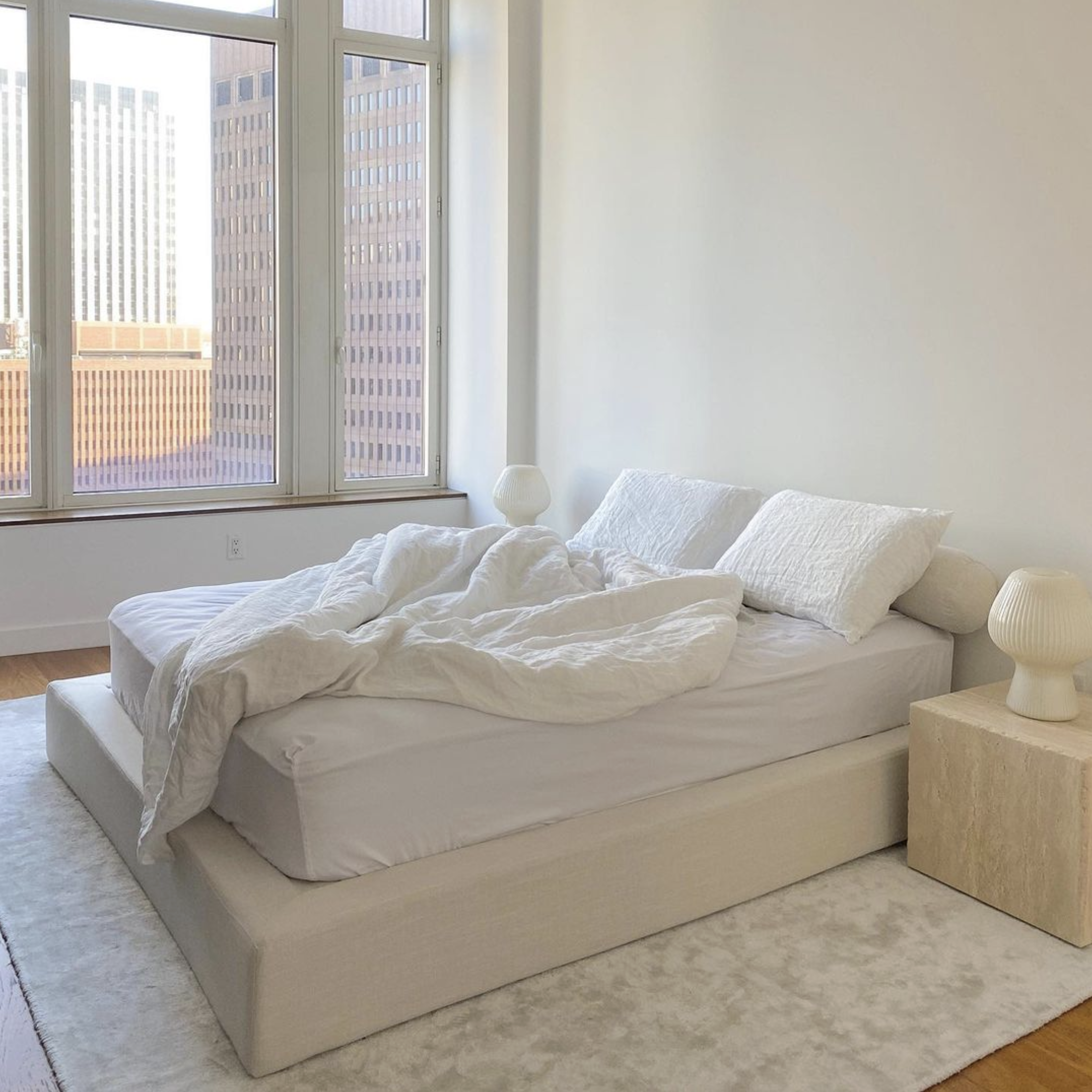 Cloud bed frame in a clean girl aesthetic bedroom